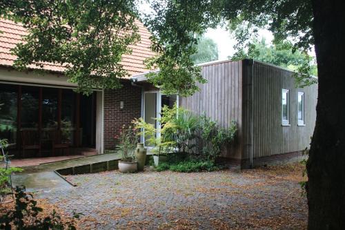 B&B Even Heukelom - Kamer met Tuin