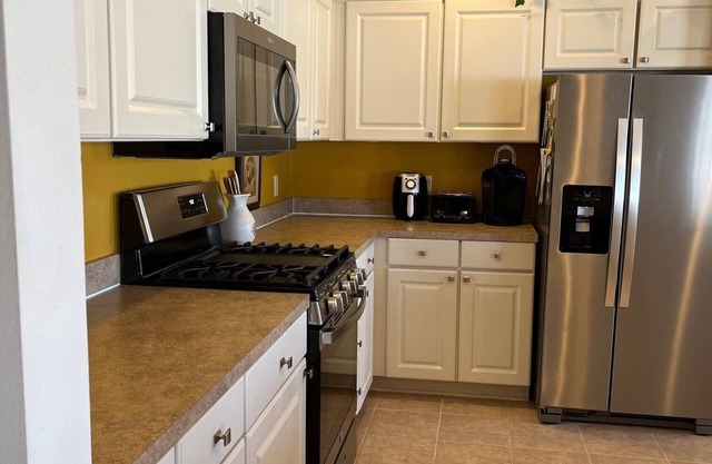 Beautiful,1700 sf, CY Villa, 2 BR & Study, fenced yard, golf cart Small dogs ok.