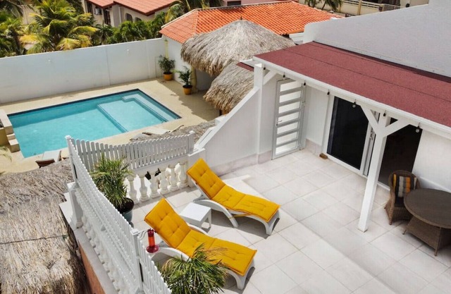 Chic Studio with Private Terrace & Pool Access at Beach Walk 6 by Bocobay