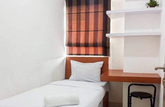 Comfort And Minimalist 2Br At Candiland Apartment