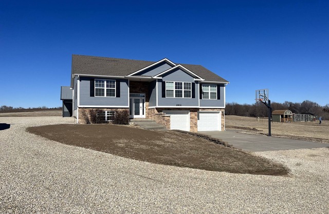 Country home with lake access and game room.