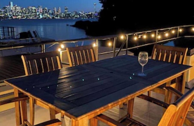 Lake Union houseboat with skyline views from all three decks. Luxury living.