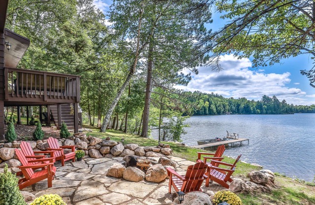 Lakefront home on snowmobile trail with kayaks/SUP, fireplace, game room & AC