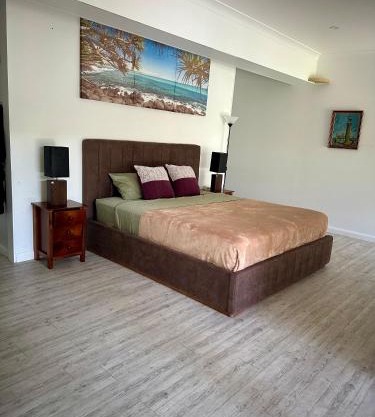 One bedroom with shared bathroom ground level of a two-story house