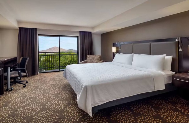Standard King at Holiday Inn & Suites Airport North - Pool and Outdoor Dining