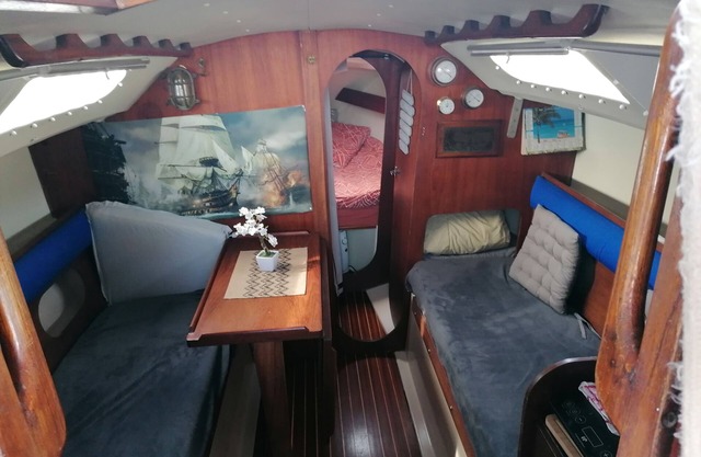 Stay on a charming sailboat at the quayside.