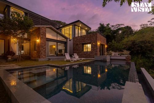 StayVista's Ikebana - Living By The Forest Edge - Mountain-view Villa with Infinity Pool, Lawn, & Indoor-Outdoor Games