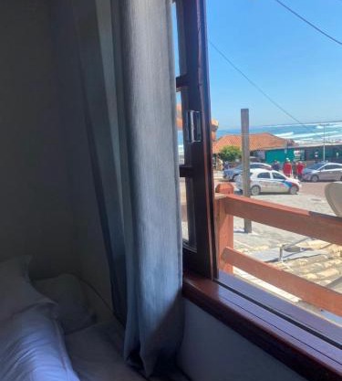 Suites e Quartos Em frente a Praia Grande -Na orla Flavia Alessandra