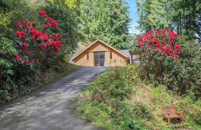 Timber lodge set in an elevated position with views of the lakes.