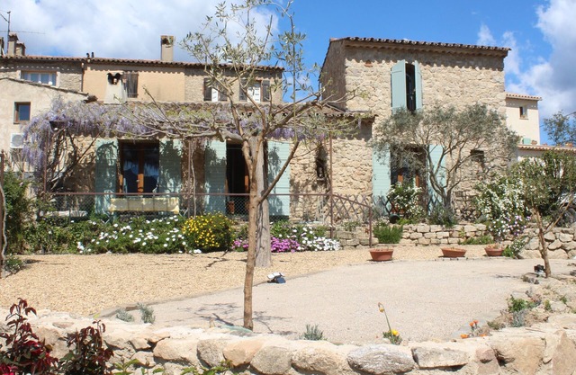 Typical stone house with garden in a quiet hamlet surrounded by vineyards