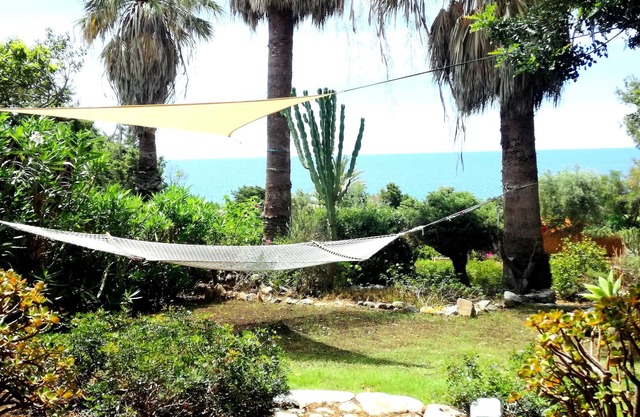 Villa on the sea surrounded by a large garden 100m from the beach of Cala Caterina