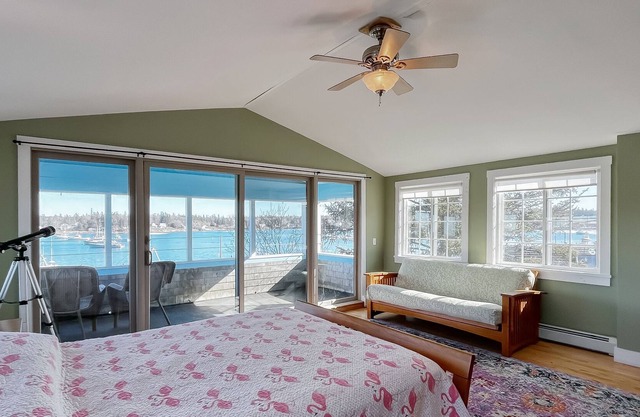 Wonderful water view home with gas grill, balcony, deck, kitchen, & DVD player