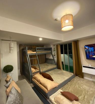 San Fernando Apartment | 1-BR Condo with 4 BEDS, DINING, Karaoke,NETFLIX,YTpremium,GAMES,WIFI,25TH fLoor - Sunrise & Sunset CITY&POOL view , wrap-around BALCONY