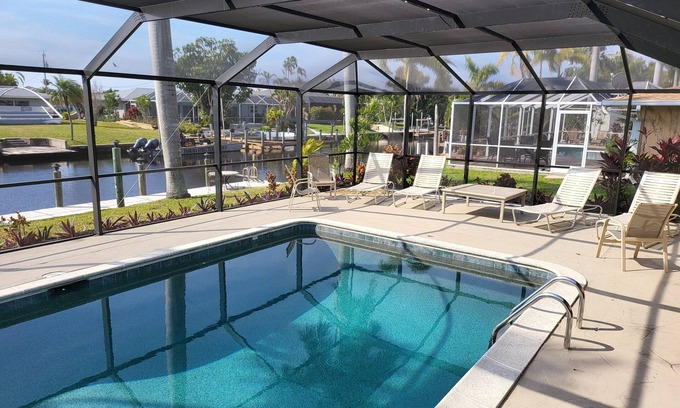 Pelican House | 4 Bedroom 3 bath Canal, South facing Pool home,