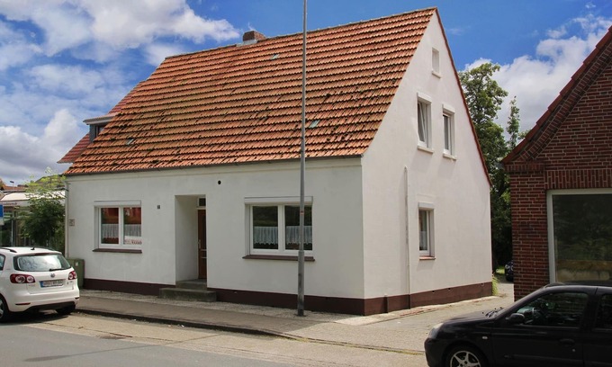 Carolinensiel Apartment | Apartment in Carolinensiel with a high chair and bed