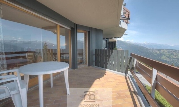 Anzere Apartment | Apartment with entrance corridor with 1 bunk beds, 1 bedroom with 2 single beds is separated from th