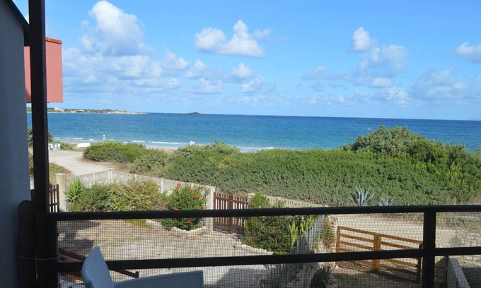 Sa Rocca Tunda Apartment | Apartment with veranda overlooking the sea 20 meters from the beach of the locality immersed in the
