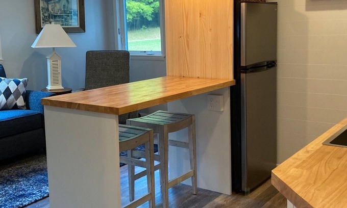 Ludington Apartment | Beautiful wooded area right outside your door and a 5 minute walk to Hamlin Lake