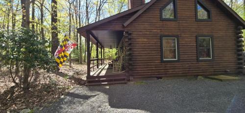 Swanton House | Camp Valentine- charming 3 bedroom cabin with hot tub and fireplace in private setting