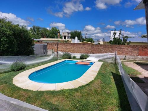 Villa Giardino House | Casa con pileta y excelente ubicación a una cuadra de la plaza principal en Villa Giardino