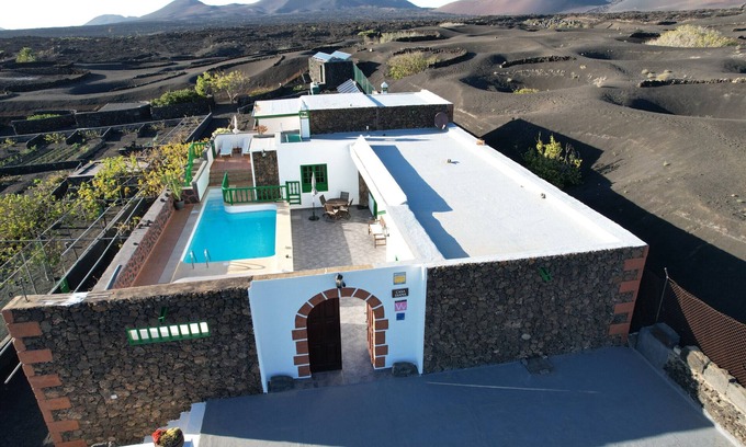 La Geria Ski Chalet | Casa Diama 1: view of La Geria and shared swimming pool