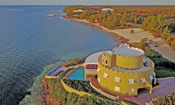 Gun Bay House | Cayman Castle: Luxury Gated Estate w/Elevated Views, Infinity Pool + Large Priva