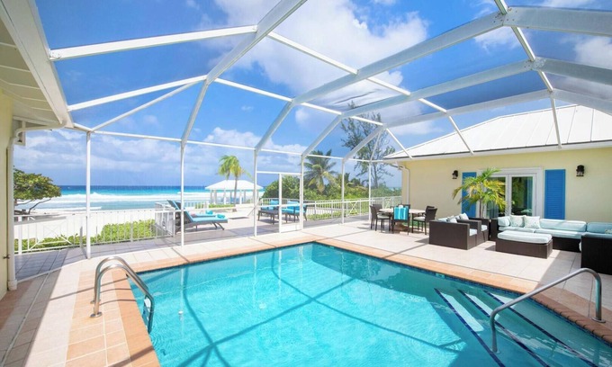 Old Man Bay House | Cayman Sands: Secluded Beach Villa with Pool Atrium & Guest Cottage