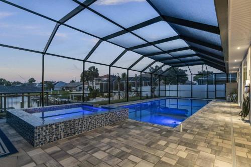 Palm Harbor House | Coastal Paradise Waterfront Pool Home