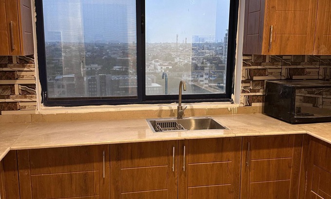 Rawalpindi Apartment | Cosy Sky-High Retreat: Ultimate Cityscape from the Top Floor