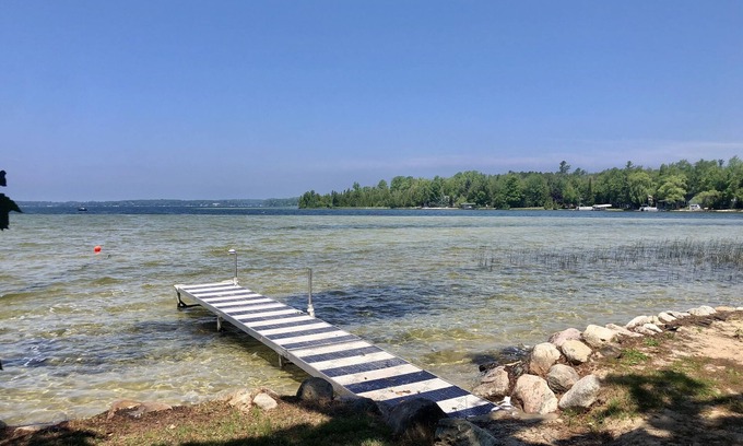 Lake Leelanau Cabin | Cozy waterfront sunset cottage on Lake Leelanau. Air, Near Leland.