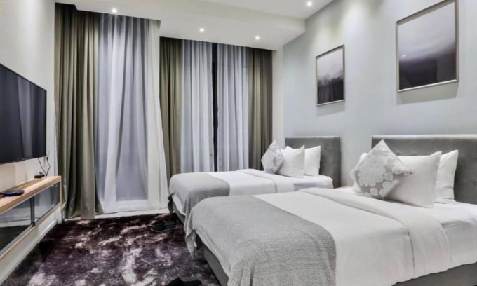 Malaysian Police Training Centre Apartment | Deluxe King Suite with Twin Tower View 3