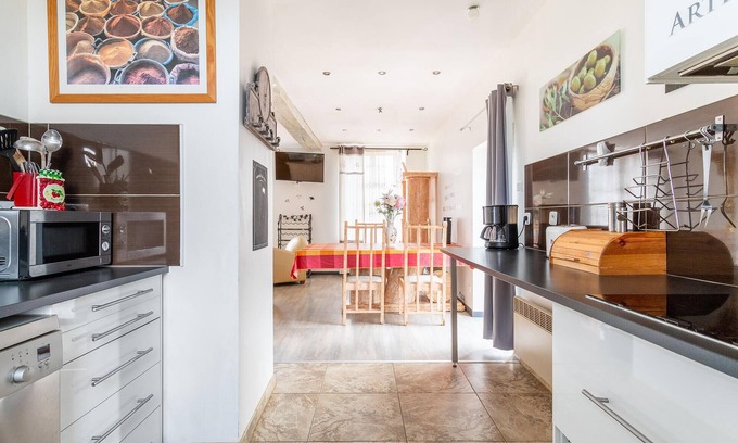 Ferriere-la-Petite House | Enjoy this cozy and pretty vacation home by a stream in green surroundings.
