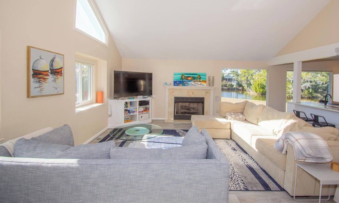 Blue Heron Lake House | Fenced backyard w/ pond, fire pit, screened porch, ping pong, Golf cart incl.