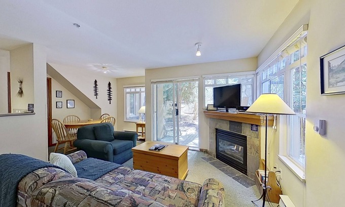 Village North Condo | First-floor condo with fireplace & patio - walk or shuttle to ski lifts
