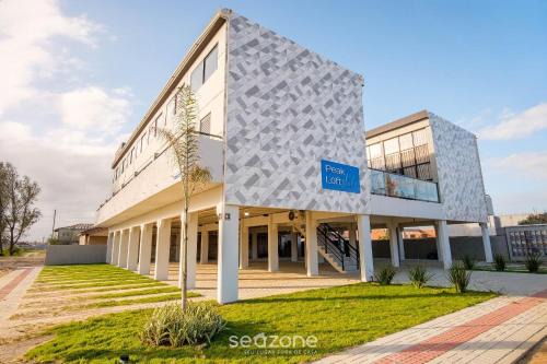Jaguaruna Apartment | Flats completos e modernos em Jaguaruna a 50m da Praia - PLO