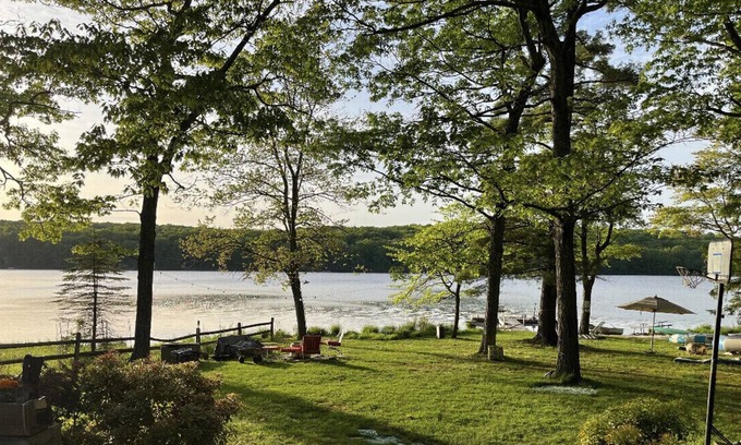 Milford House | Glacial lake on top of mountain, boats, floating dock, fishing, swimming, beach.