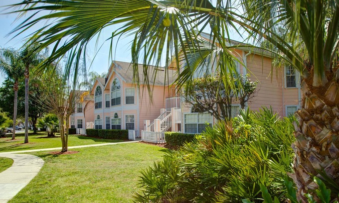 Royal Palm Bay Condo | Ground floor, With a pond view patio.