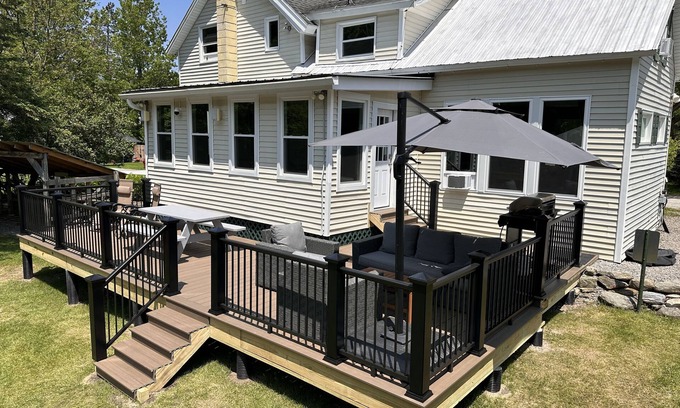 Montgomery Center House | Inviting riverfront home with hot tub on deck & fireplace, near skiing & golf