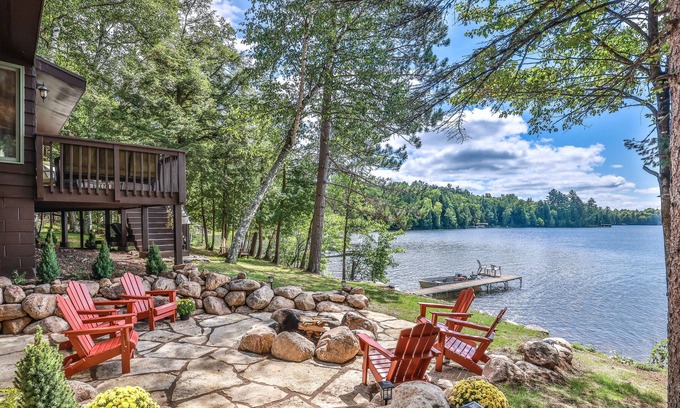 Presque Isle Cabin | Lakefront home on snowmobile trail with kayaks/SUP, fireplace, game room & AC