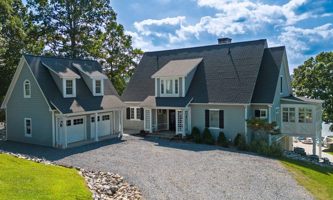 Moneta House | Lakefront home with amazing views, dock, firepit, foosball, patio, garage studio