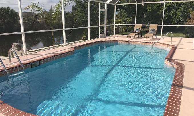 Pelican Villa | LOCATED ON GULF ACCESS CANAL WITH VIEWS!nBrand new pool enclosure!