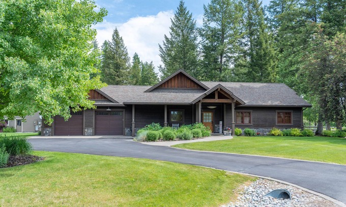 Kalispell House | Magical mountain retreat with a firepit, patio, W/D, & central AC - dog-friendly