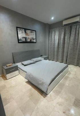 Al Koudh Apartment | Modern Cozy Apartment with Elegant Gray Design & Smart Lighting