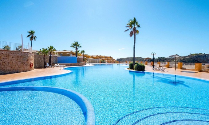 Cumbre del Sol Apartment | Nice apartment for 4 guests with WIFI, pool, A/C, TV and patio