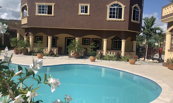 Runaway Bay Apartment | Pool View Two Bedroom Apartment with En-Suite, Open Kitchen and Living Room