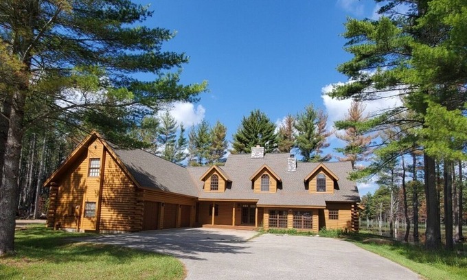 Gaylord House | Private wooded lake front log cabin perfect for large groups