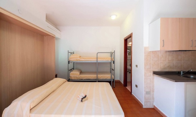 Grotta dell'acqua Resort | Property In A Holiday Village 'Monolocale Con Giardino' with Shared Pool and Air Conditioning