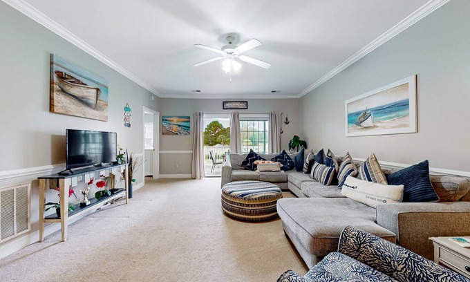 Central Myrtle Beach Condo | Quiet golf community with security, covered balcony, W/D, AC, & pool access