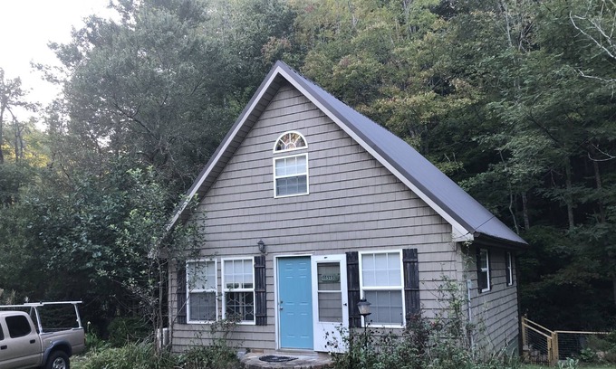 Marshall Cottage | Relax in a hammock chair to the sounds of Mill Creek in Madison County, NC