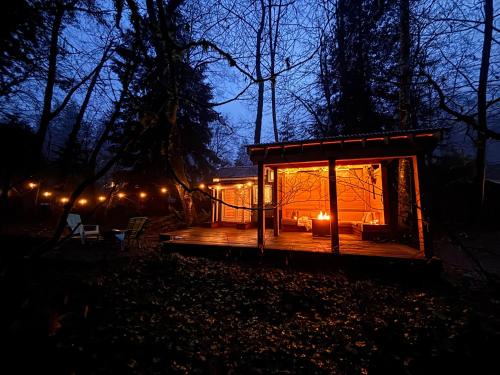 Woodfibre House | Riverwood Retreat-hot tub and cedar sauna on the river